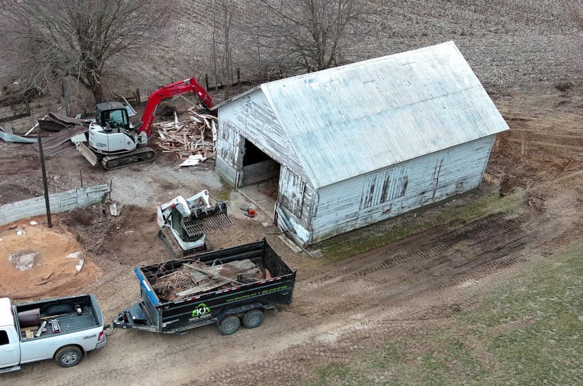 Barn demolition and debris removal with excavation equipment in Eastern Iowa.